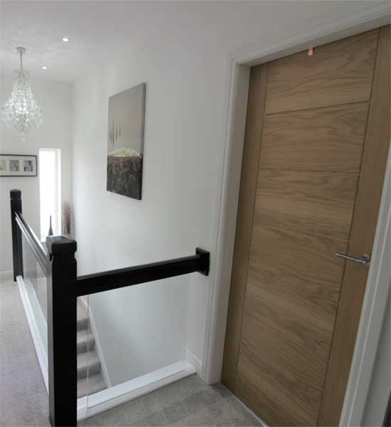fitted wooden door with custom built staircase
